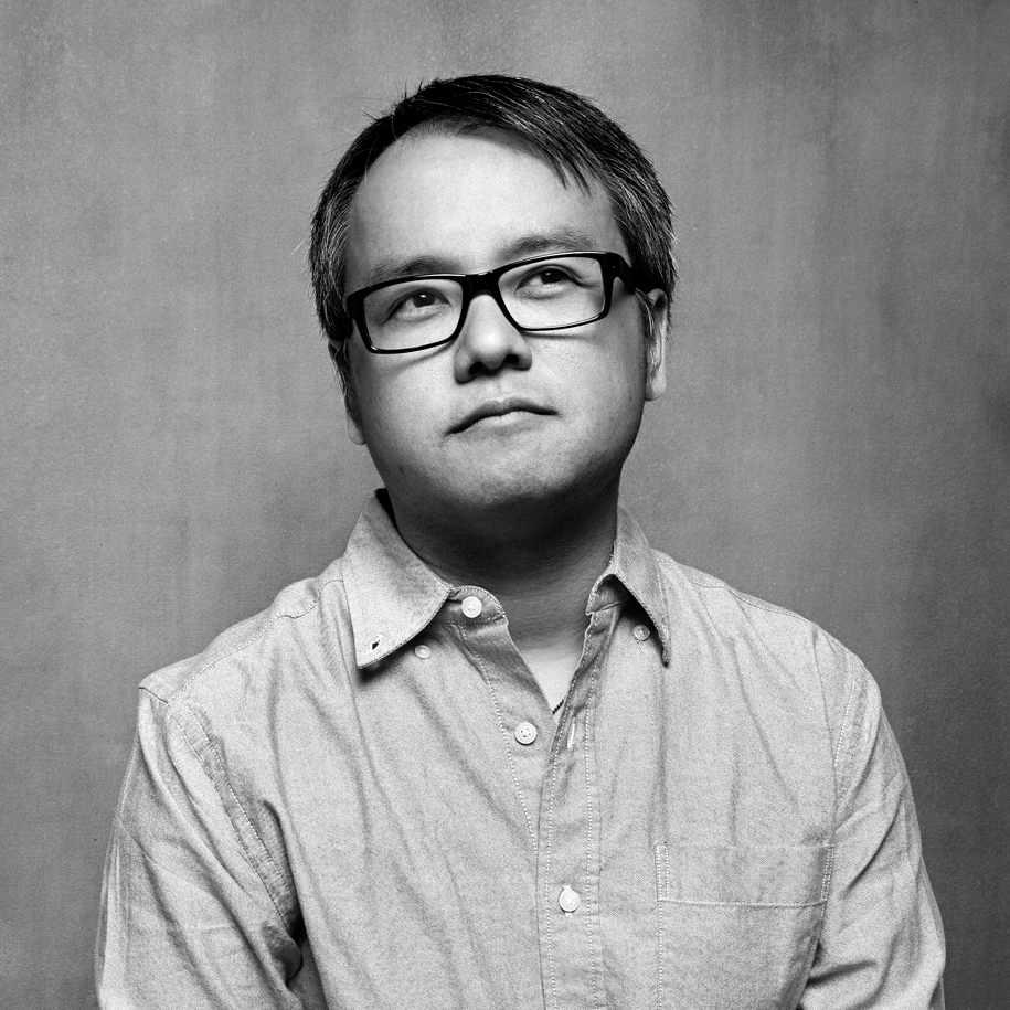 Qui Nguyen, black and white photo with glasses and short dark hair